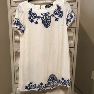 White dress with royal blue stitching